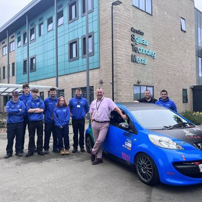 Motorsport Engineering students with the Peugeot 107 that will compete at the Student Motorsport Challenge