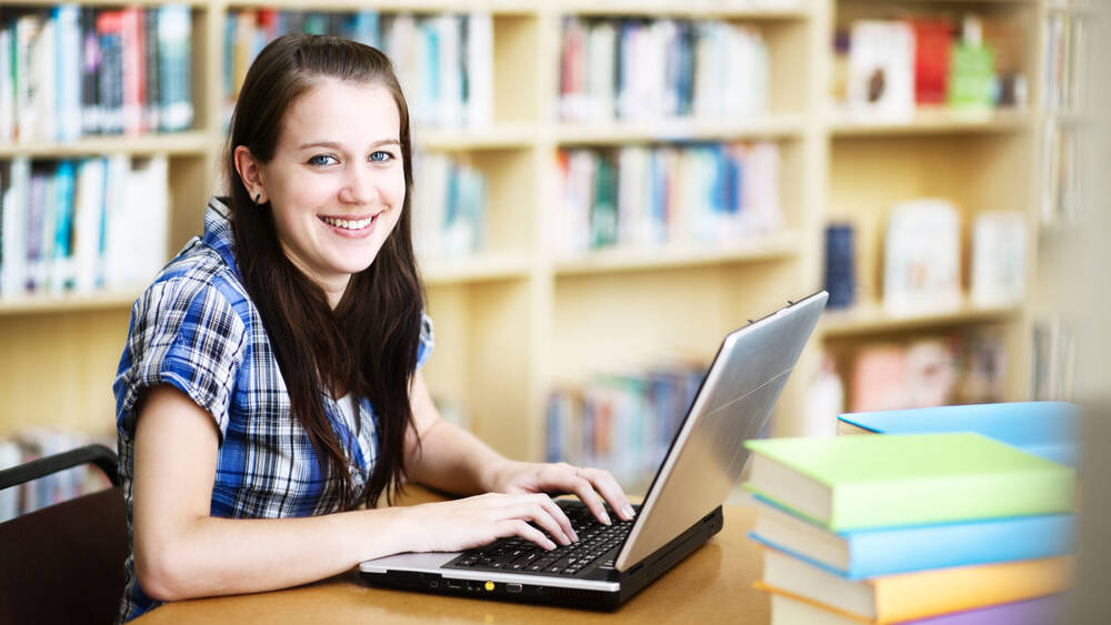 Stock image of learner in Library