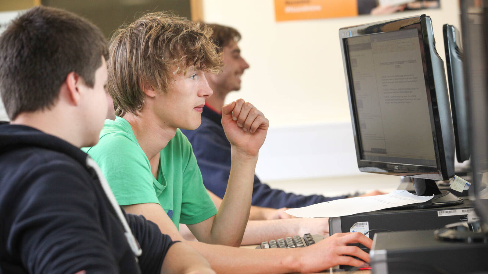 Three Glynllifon learners working in the computer room