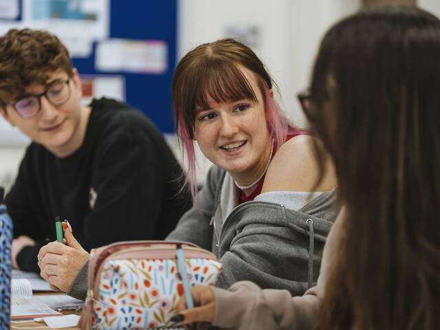 Students talking in a classroom