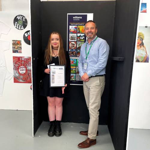 Coleg Llandrillo student Lucy Morris is presented with her runners-up certificate by Jason Williams, proprietor of Williams Estates