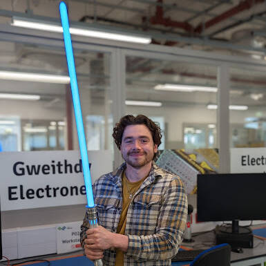 Adam Hopley with the lightsaber he created as part of his Level 3 BTEC Extended Diploma in Electrical Engineering