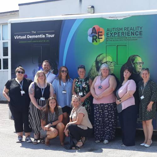 Staff with the dementia bus at the Busnes@LlandrilloMenai site in Abergele