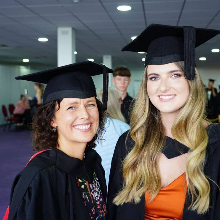 Nia Parry and Siwan Griffiths at the Grŵp Llandrillo Menai graduation ceremony at Venue Cymru