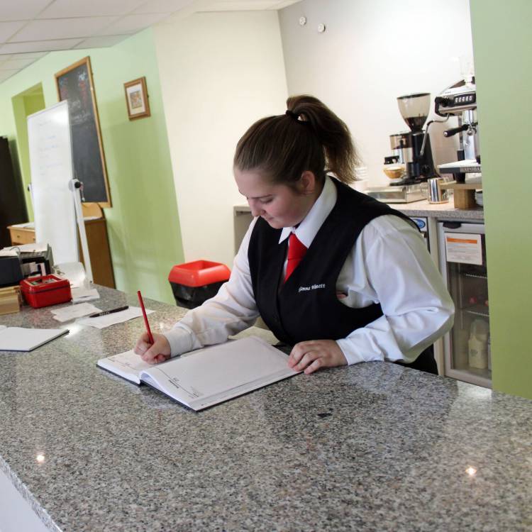 A student working in The Bistro at Coleg Llandrillo’s Rhos campus