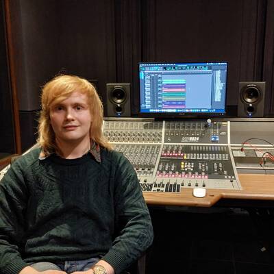 Former Coleg Llandrillo student Alex Snape in a recording studio at LIPA