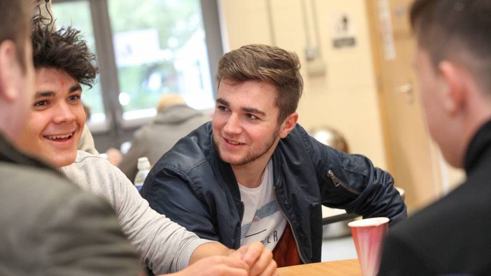 Students socialising with a coffee