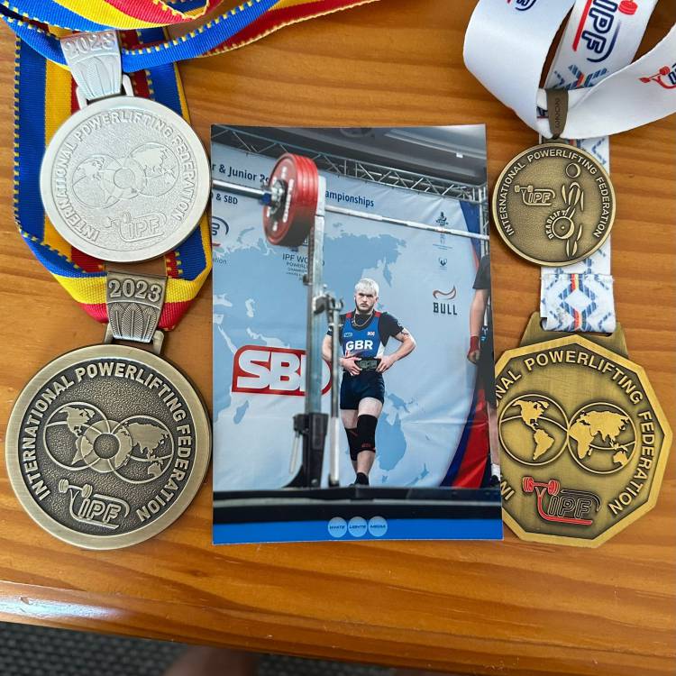 Lucas Williams’ medals from the World Championships in Romania, pictured with a photograph of him competing