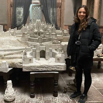 Former Coleg Menai student Beth Elen Roberts with the model of Old Valyria she helped design for House of the Dragon