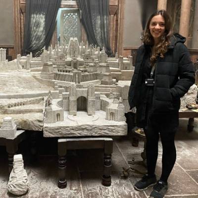 Former Coleg Menai student Beth Elen Roberts with the model of Old Valyria she helped design for House of the Dragon