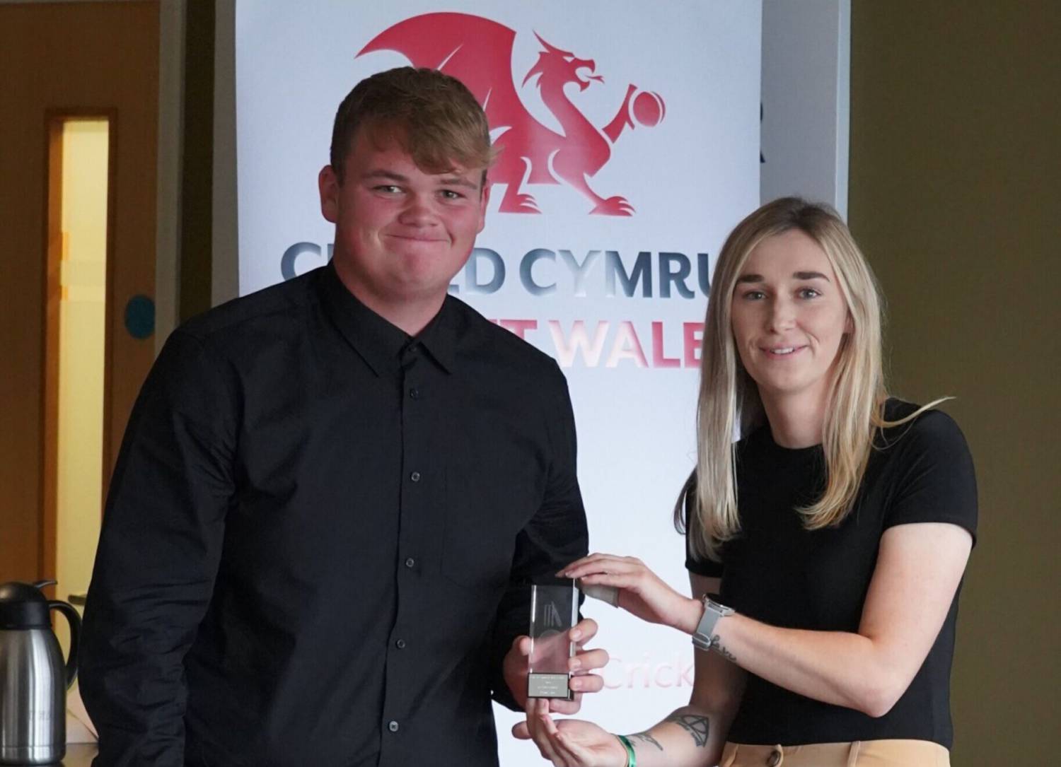 David Owen being presented with his Cricket Wales 2023 Rising Star award by Rachel Warrenger, Women’s and Girls’ Development Officer