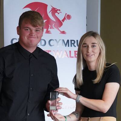 David Owen being presented with his Cricket Wales 2023 Rising Star award by Rachel Warrenger, Women’s and Girls’ Development Officer