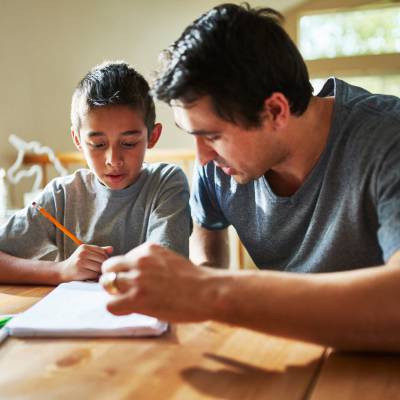 Father helping son with homework