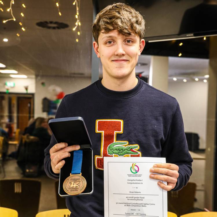 Osian Roberts with his bronze medal in CNC Turning from Skills Competition Wales