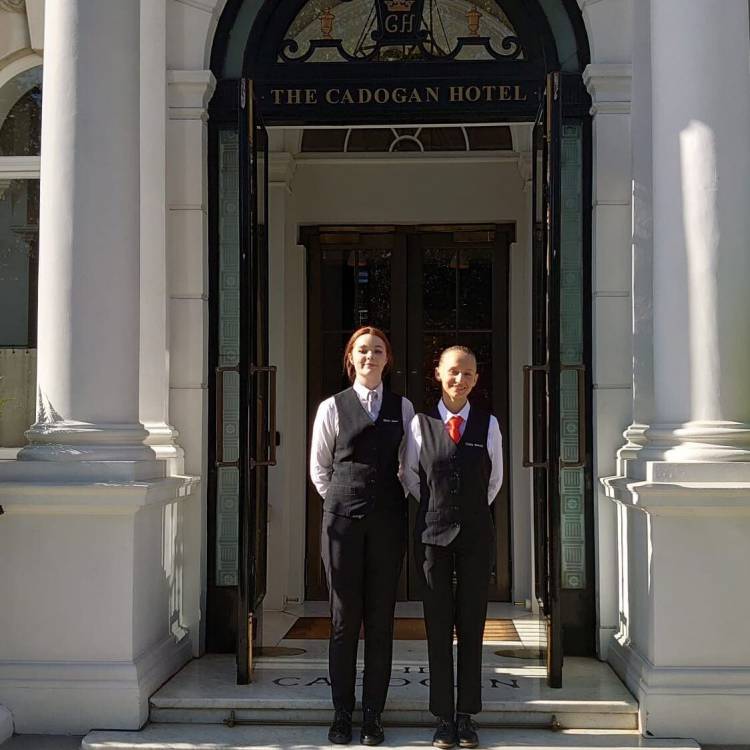 Coleg Llandrillo students Rhian James and Yuliia Batrak outside The Cadogan Hotel