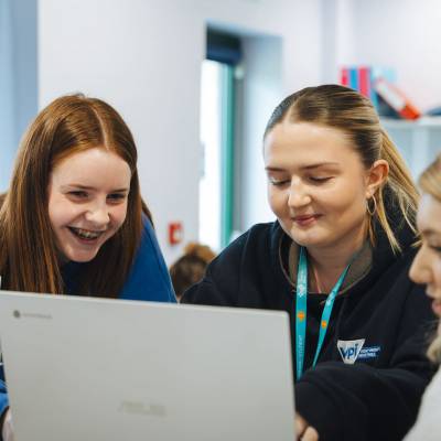 Students using a laptop at Coleg Menai’s Llangefni campus