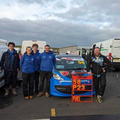 Driver Hywel Rosenthal and the Menai Motorsports team with the Peugeot at Trac Môn