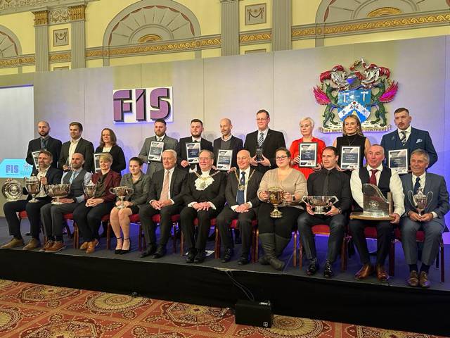 Kat on stage with award