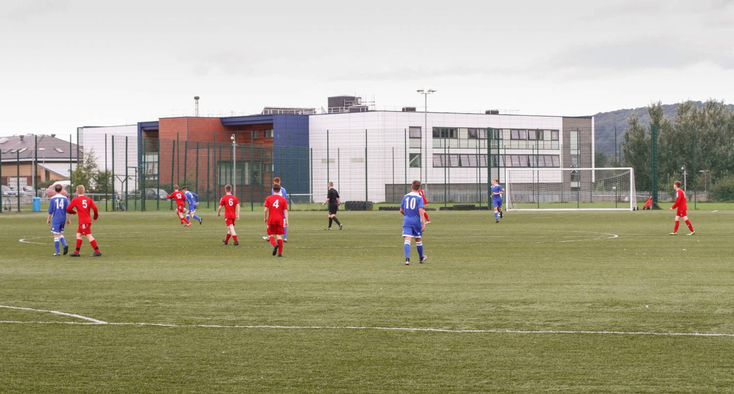 Learners playing football on 3G pitch