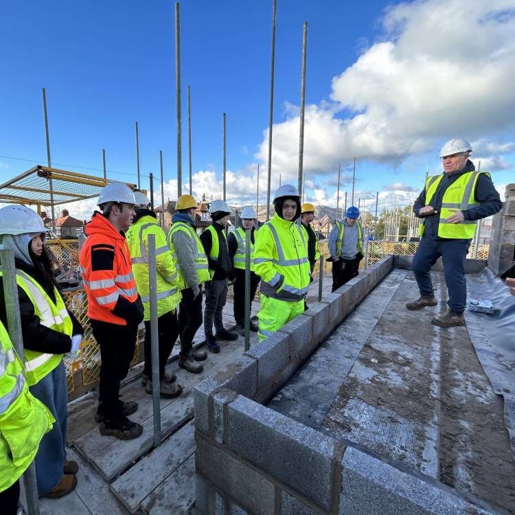 Anwyl Homes contracts manager John Wilson talks to the students