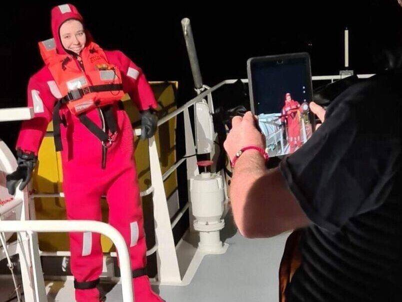 Former Coleg Menai student Stephanie on deck in an immersion suit