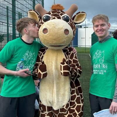Coleg Llandrillo students with ‘Josh the Giraffe’, mascot of The Joshua Tree charity
