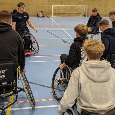 Alex Marshall-Wilson talking to students in the sports hall at Coleg Llandrillo’s Rhos-on-Sea campus