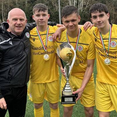 Marc Lloyd Williams, Harry Hughes, Osian Evans and Morgan Davies with the trophy after Welsh Schools Under-18 boys won the Roma Caput Mundi