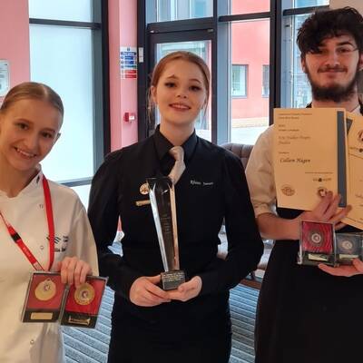 Yuliia Batrak, Rhian James and Callum Hagan with their trophies and medals from the ACF Northwest Commis Chef of the Year competitions