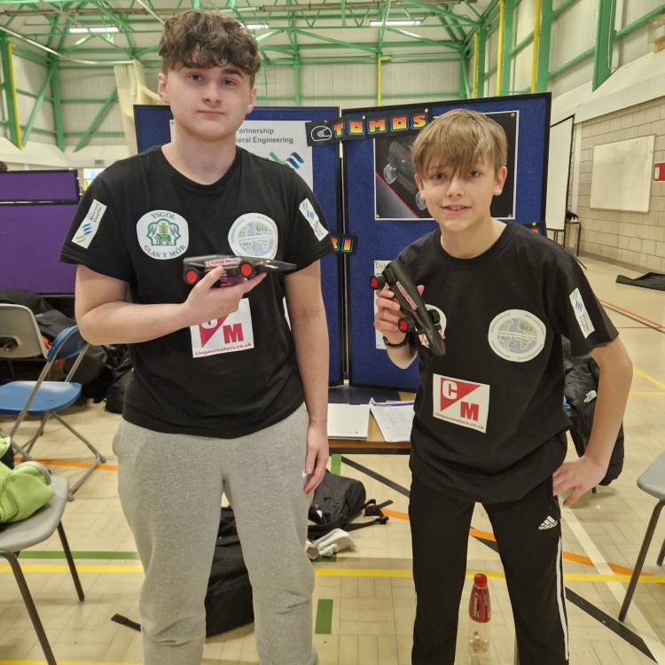 High-school students with their cars at the F1 in Schools North Wales heats in Denbigh Leisure Centre