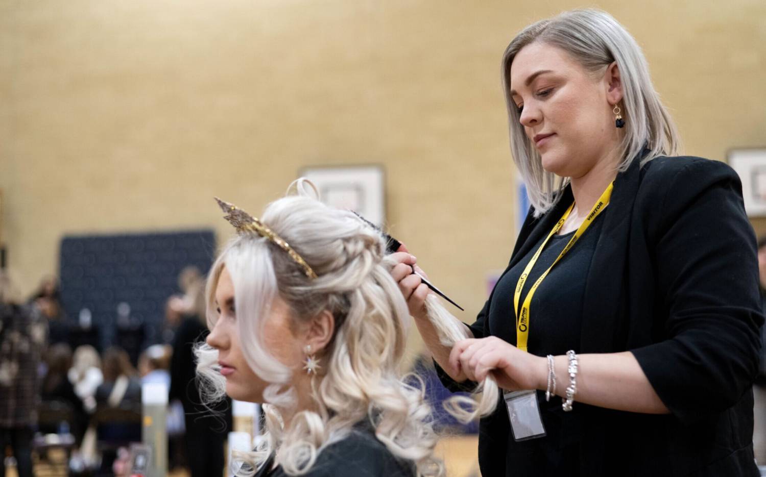 Coleg Llandrillo student Heather Wynne styling hair at the 2024 Concept Hair Learner of the Year final
