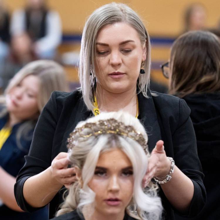 Coleg Llandrillo student Heather Wynne styling hair at the 2024 Concept Hair Learner of the Year final
