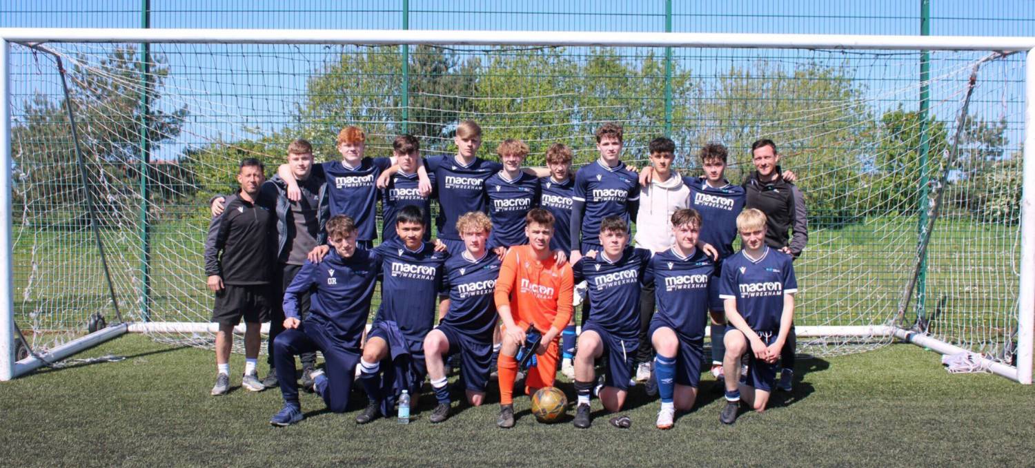 The Coleg Llandrillo Football Academy team after winning the league title