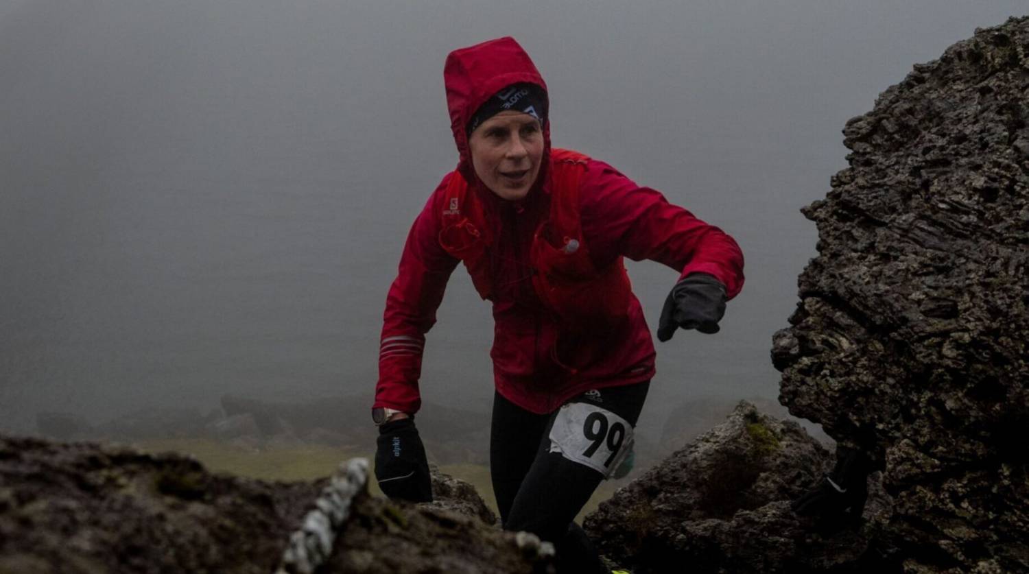 Alwen Williams reaching the top of a climb in Ras y Moelwyn