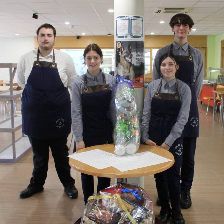 Students with one of the ‘Guess the Name of the Dog’ teddies