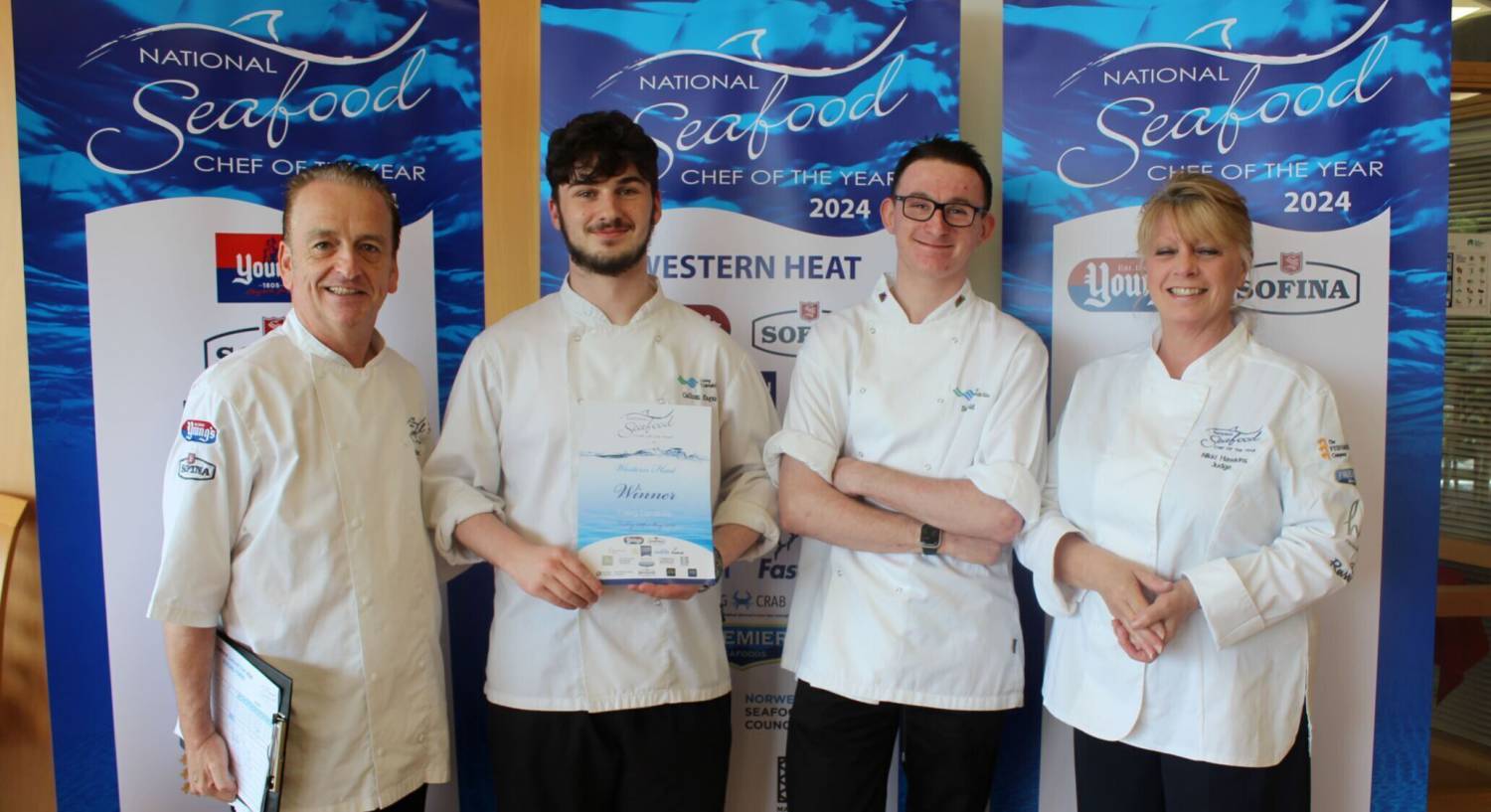 Callum Hagan and Ben Nield being presented with their certificate by judges after winning their National Seafood Chef of the Year heat