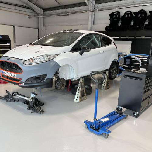 A Fiesta R2 Rally car undergoing repairs at Myerscough College motorsport department