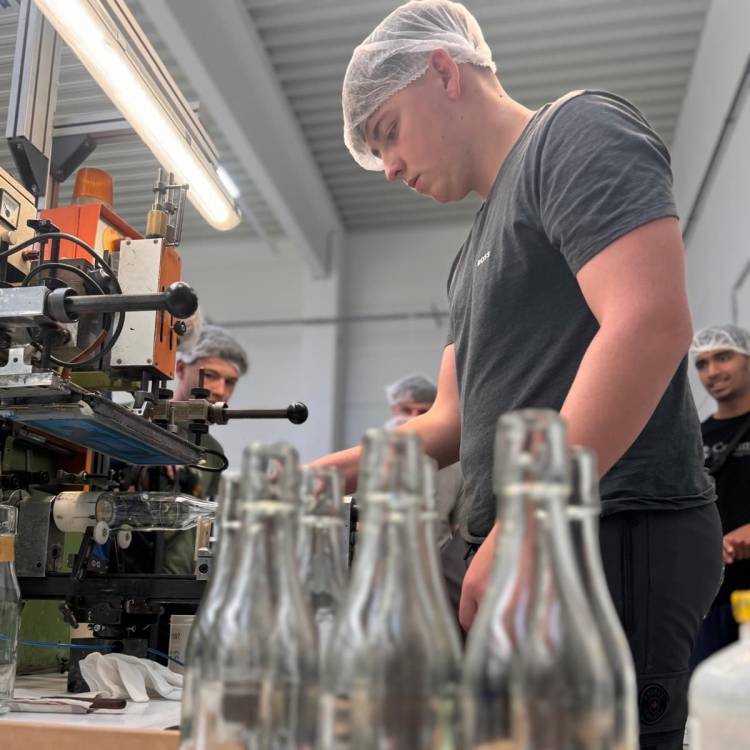 Students gaining experience of manufacturing bottles at the HeinzGlas factory