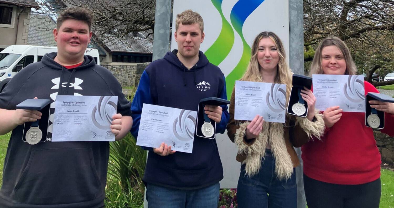 Iwan Bauld, Euron Jones, Cherry Smith and Elisha Brown with their medals after finishing second in the Skills Wales Enterprise competition