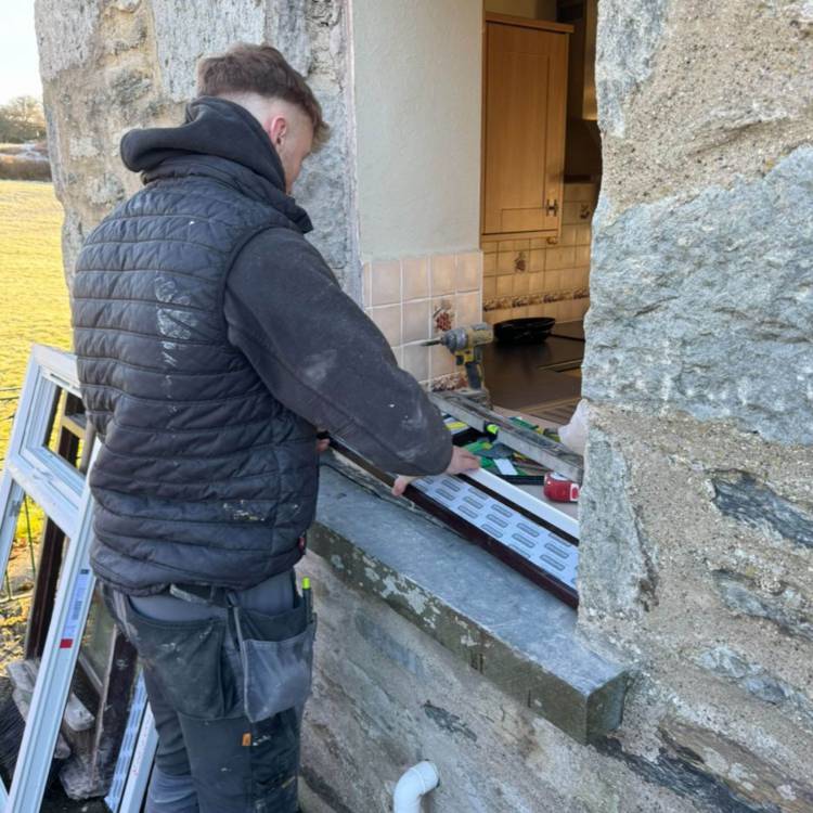 Carpentry and joinery apprentice Cain Jones working on a house