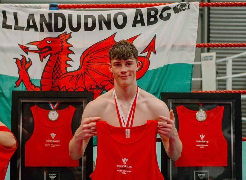 Mitchel Jones with his medals and Welsh Boxing vests