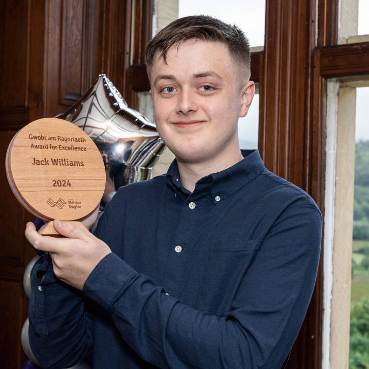 Jack Williams holding his Award for Excellence at Coleg Meirion-Dwyfor’s annual Achievers Awards 2024