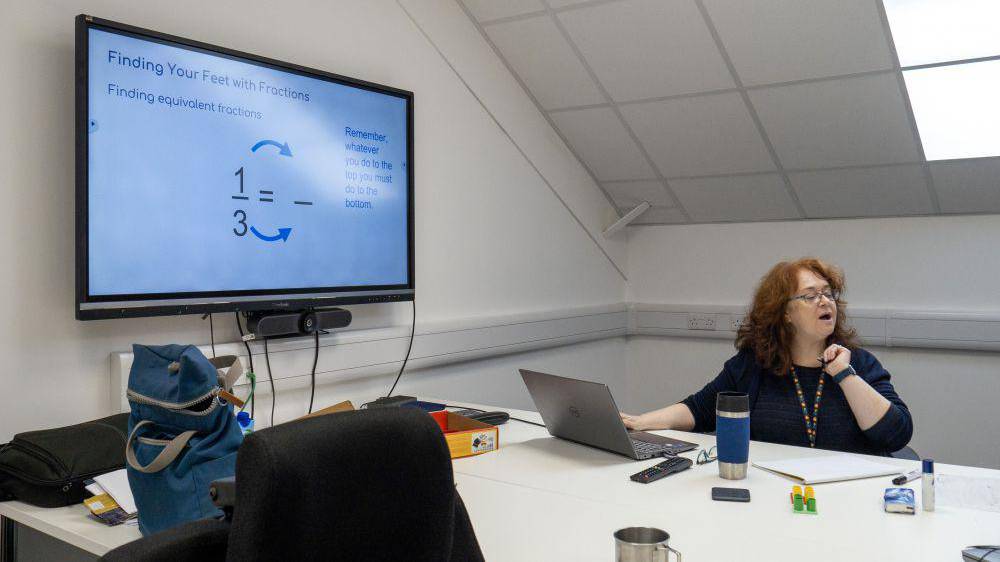 Multiply tutor Kerry Barclay-Smith running a GCSE maths class at Huws Gray’s head office