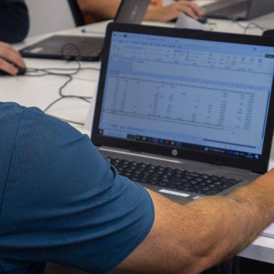 A man using a spreadsheet on a laptop computer