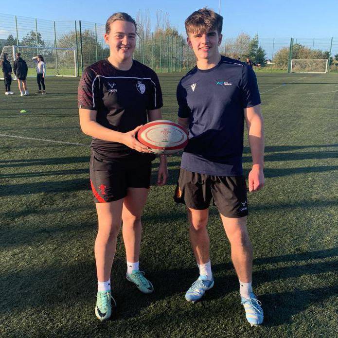 Cara Mercier and Osian Llewelyn Woodward on the 3G pitch at Coleg Llandrillo’s Rhos-on-Sea campus