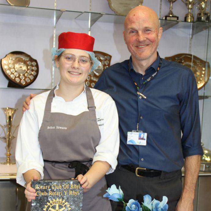Coleg Llandrillo student Bethan Edwards and lecturer Mike Garner with The Rotary Club of Rhyl Catering Award