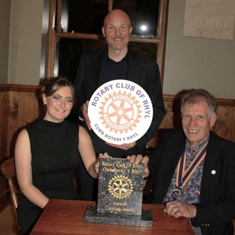 Coleg Llandrillo student Bethan Edwards with lecturer Mike Garner and Rotary Club of Rhyl president John Dicks