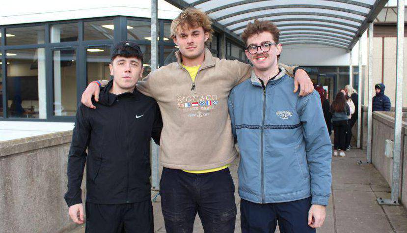 Former Coleg Llandrillo students Lewis Bartlett, Henry Wilyman and Dylan Michaelson outside the sports lounge at the Rhos-on-Sea campus