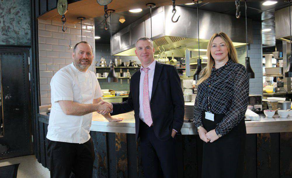 Bryn Williams with Paul Flanagan, Coleg Llandrillo Principal, and Samantha McIlvogue, Coleg Llandrillo Assistant Principal, at Porth Eirias
