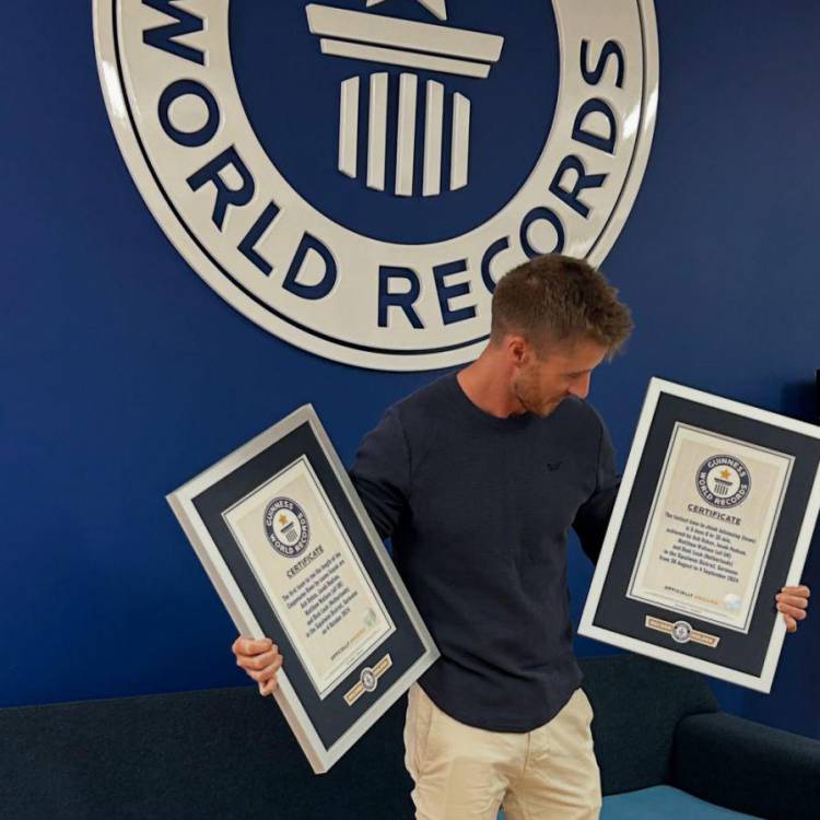 Ash Dykes with two Guinness World Records certificates achieved during his expedition in Suriname